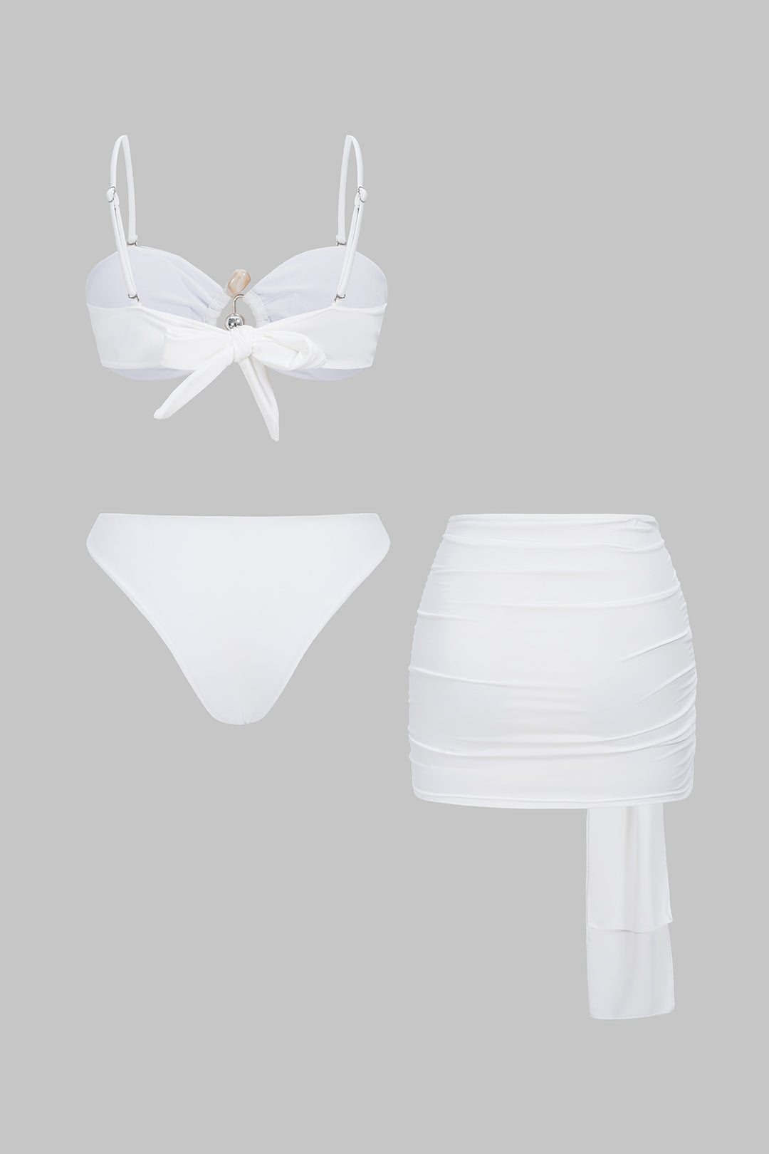 Bikini z metalicznymi wycięciami i spódnicą