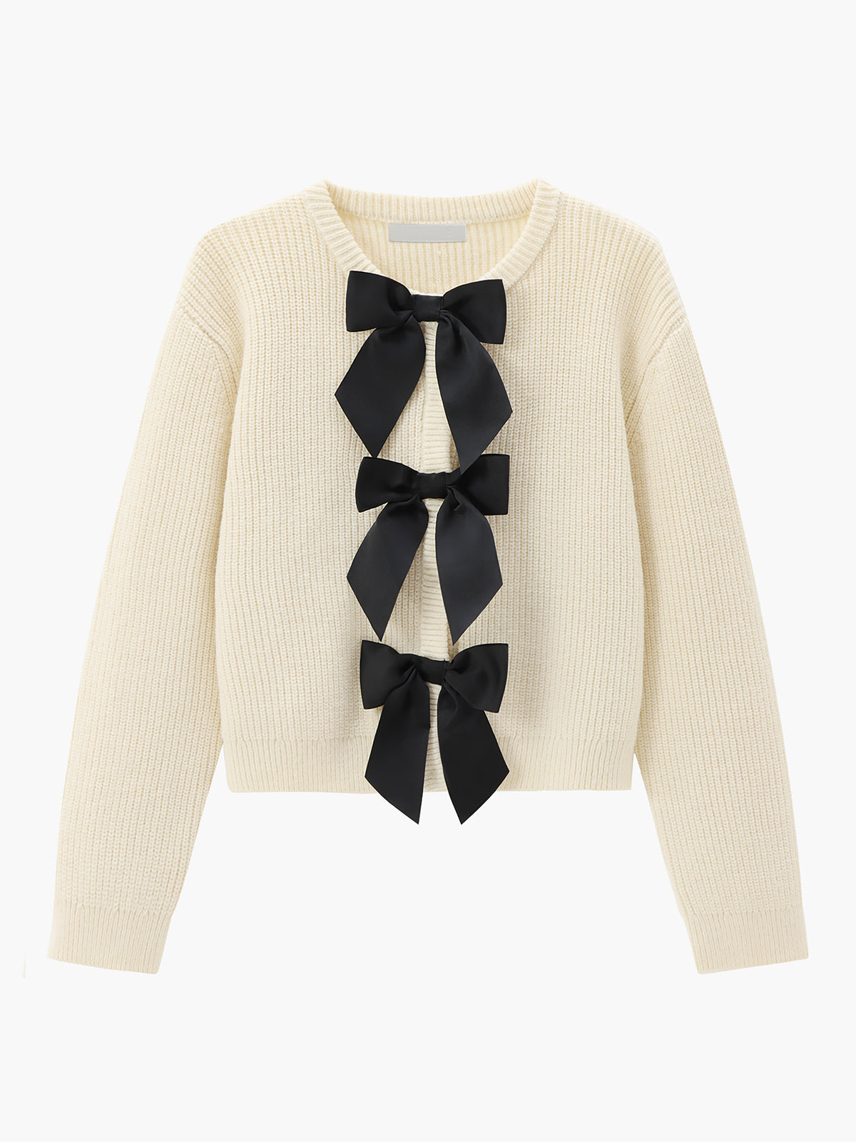 Elegancki sweter z kokardami na przodzie