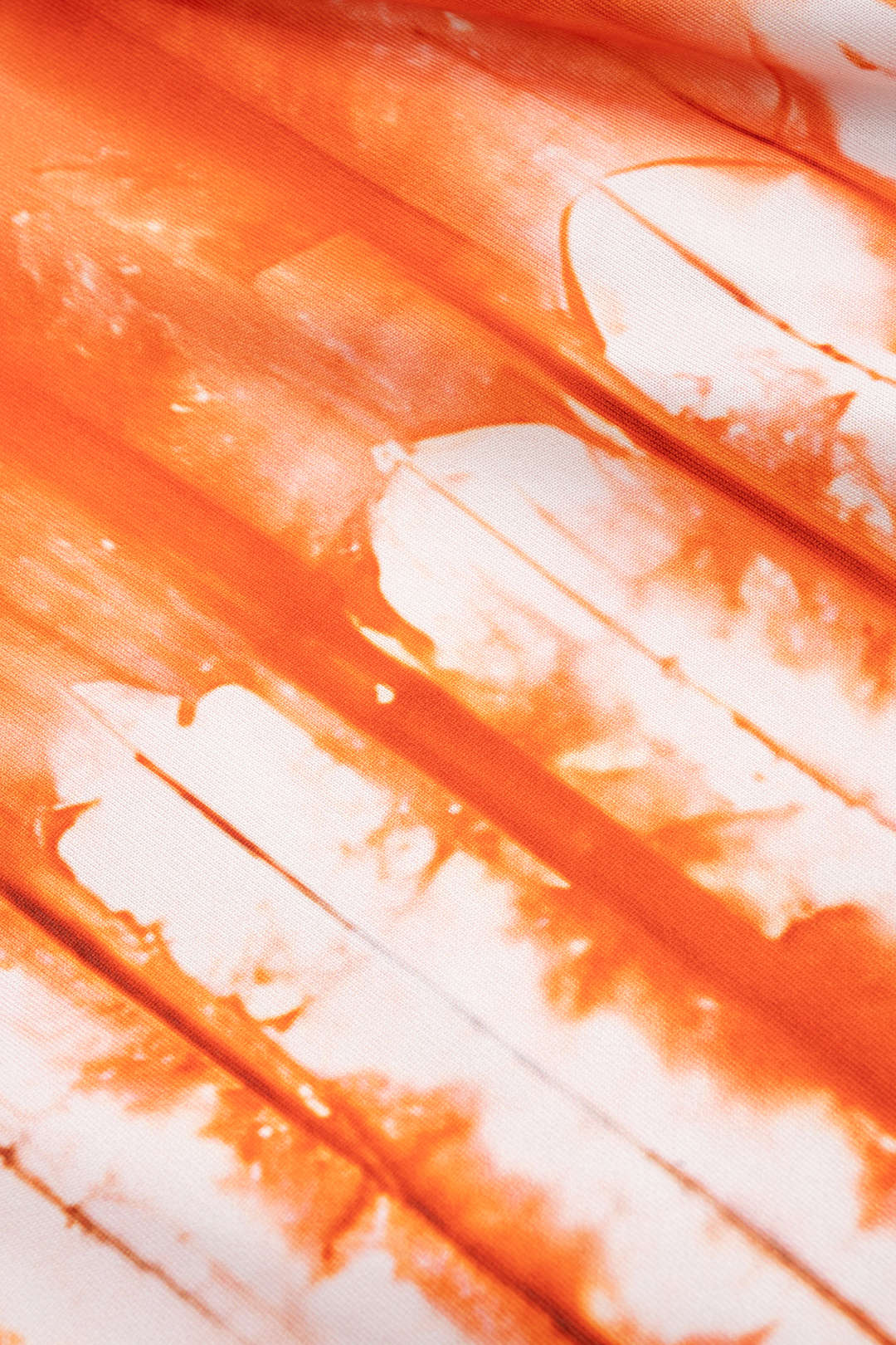 Damski zestaw z wiązanym topem i szerokimi spodniami w tie dye