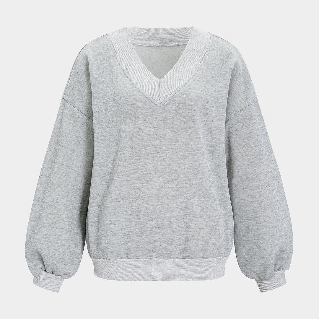Oversize'owa bluza damska z dekoltem w serek