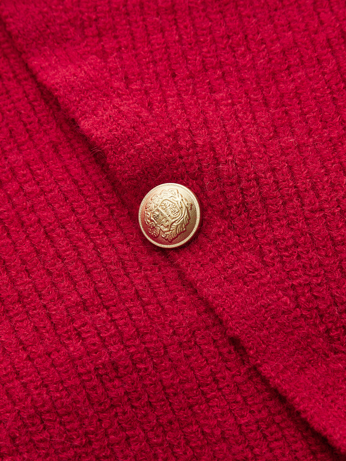 Sweter z kopertowym zapięciem i guzikami